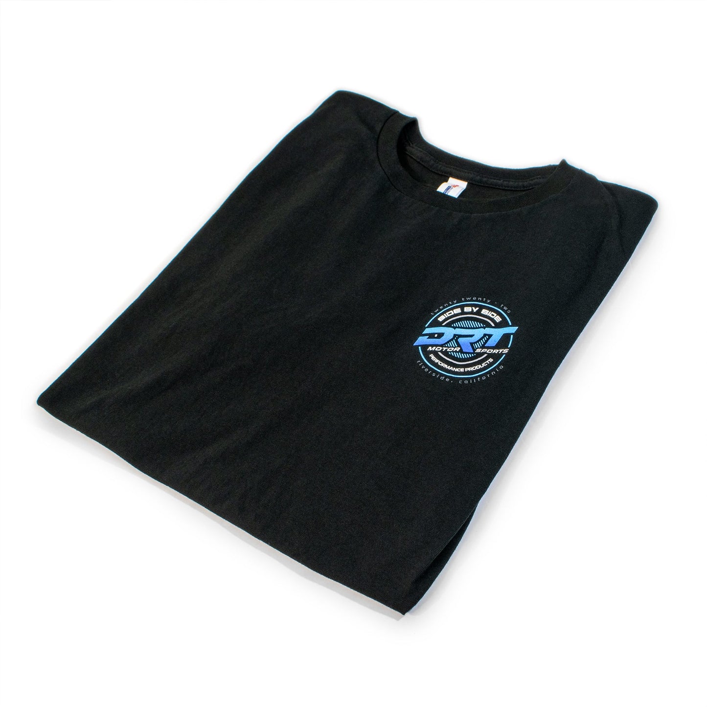 Folded tee with garment tag visible, minimalist branding